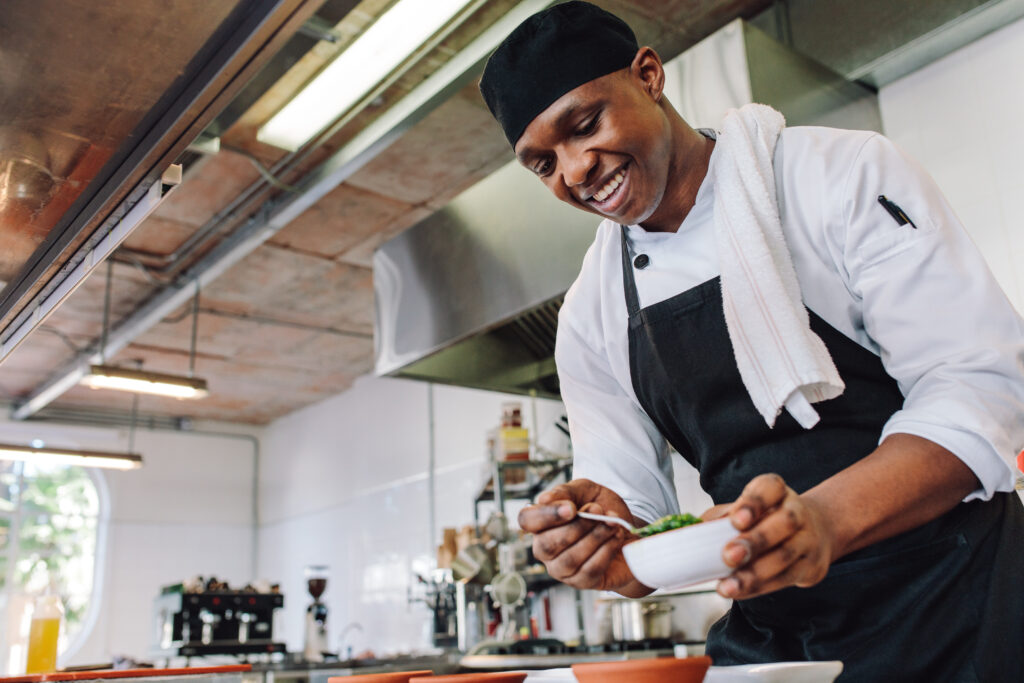 Chef cooking in a professional kitchen.