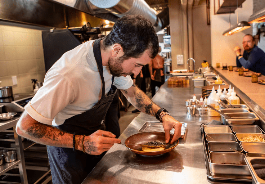 Chef plating a dish in Baldio, a zero-waste restaurant in Mexico City. What’s Shaping Menus in 2025